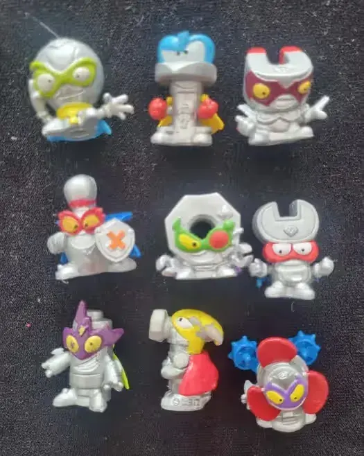 9 srebrnych figurek super zings — praca twórcy Marek na Freshwall Marketplace